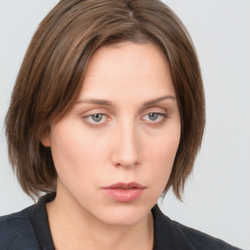 Neutral white young-adult female with medium  brown hair and grey eyes