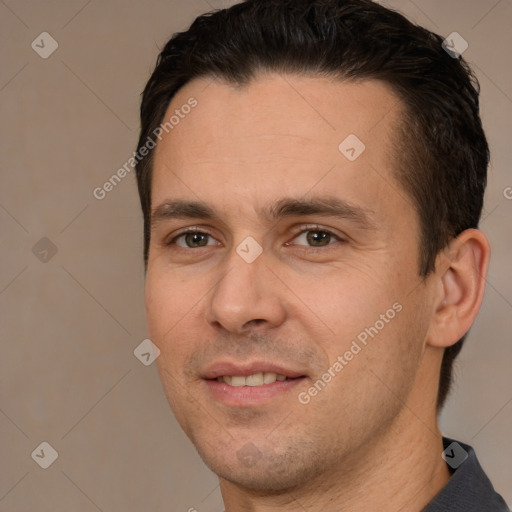 Joyful white young-adult male with short  brown hair and brown eyes