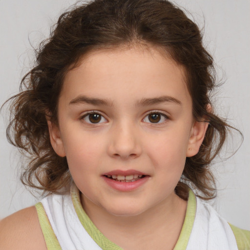 Joyful white child female with medium  brown hair and brown eyes