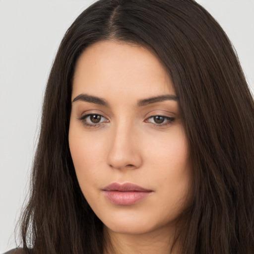 Neutral white young-adult female with long  brown hair and brown eyes