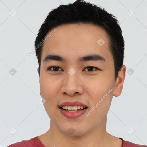 Joyful asian young-adult male with short  black hair and brown eyes