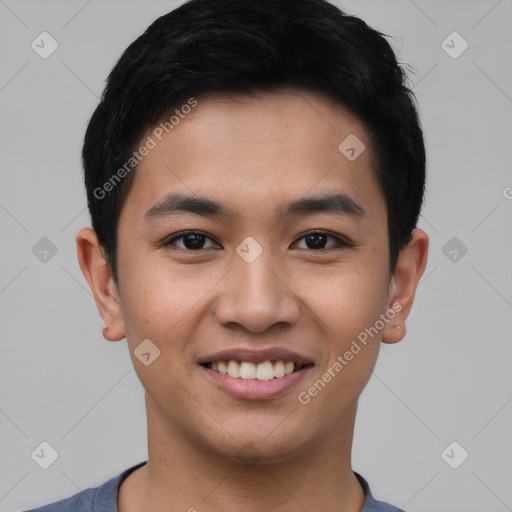 Joyful asian young-adult male with short  black hair and brown eyes