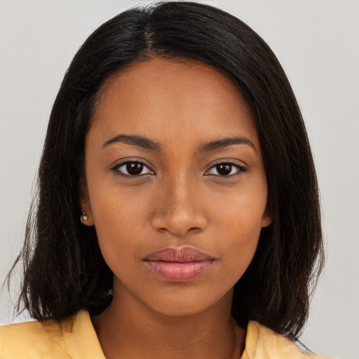 Neutral black young-adult female with medium  brown hair and brown eyes