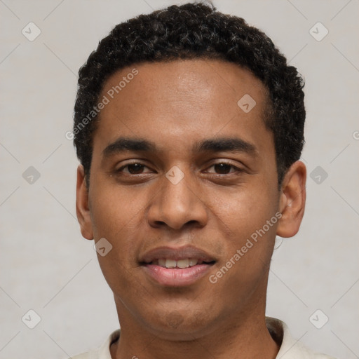 Joyful black young-adult male with short  black hair and brown eyes