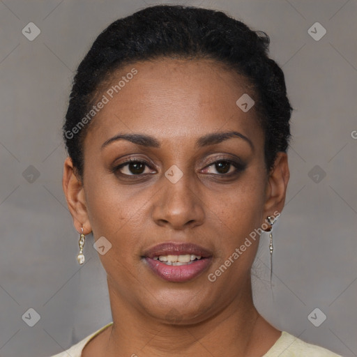 Joyful black young-adult female with short  brown hair and brown eyes