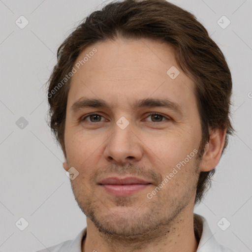 Joyful white adult male with short  brown hair and brown eyes