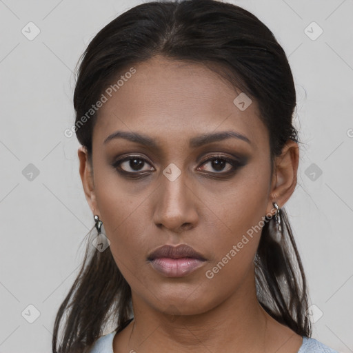 Neutral black young-adult female with medium  brown hair and brown eyes