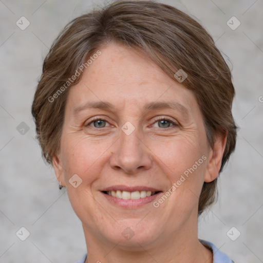 Joyful white adult female with short  brown hair and brown eyes