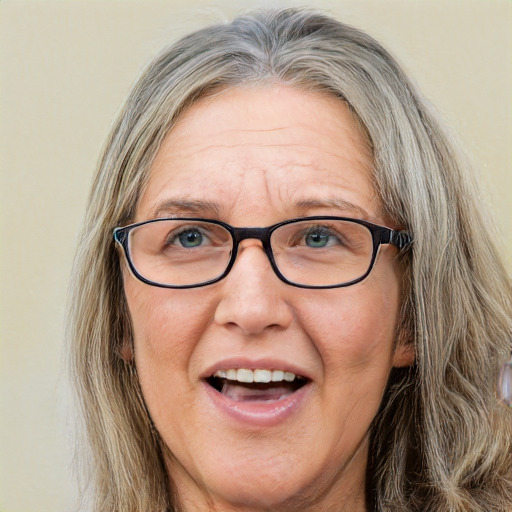 Joyful white middle-aged female with long  brown hair and blue eyes