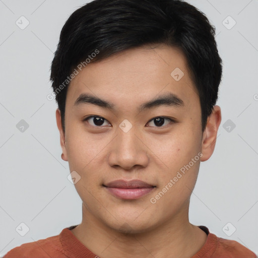 Joyful asian young-adult male with short  black hair and brown eyes