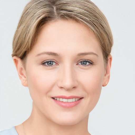 Joyful white young-adult female with short  brown hair and grey eyes