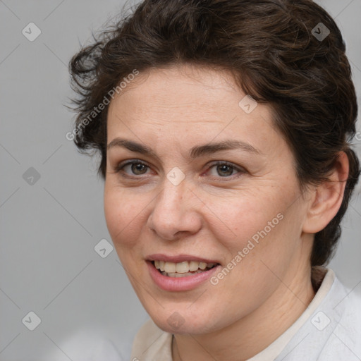 Joyful white adult female with short  brown hair and brown eyes