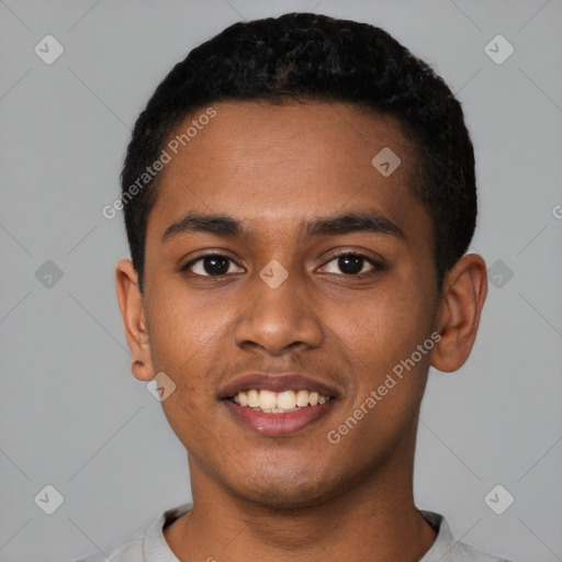 Joyful black young-adult male with short  black hair and brown eyes