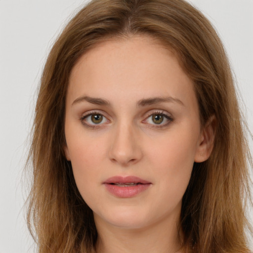 Neutral white young-adult female with long  brown hair and brown eyes