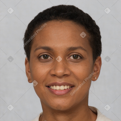 Joyful black young-adult female with short  brown hair and brown eyes