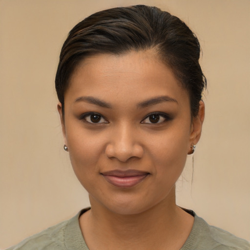 Joyful latino young-adult female with short  brown hair and brown eyes