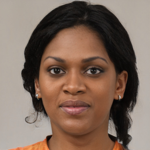 Joyful black young-adult female with medium  black hair and brown eyes