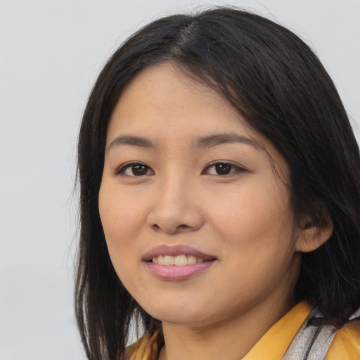 Joyful asian young-adult female with long  brown hair and brown eyes