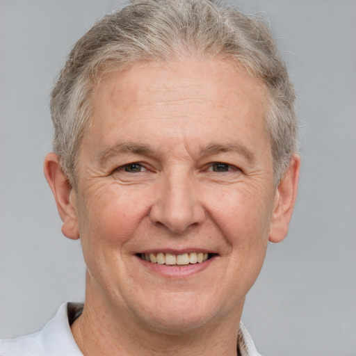 Joyful white middle-aged male with short  gray hair and grey eyes