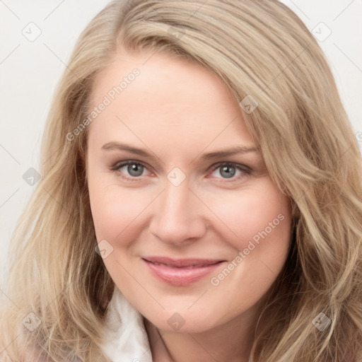 Joyful white young-adult female with long  brown hair and blue eyes