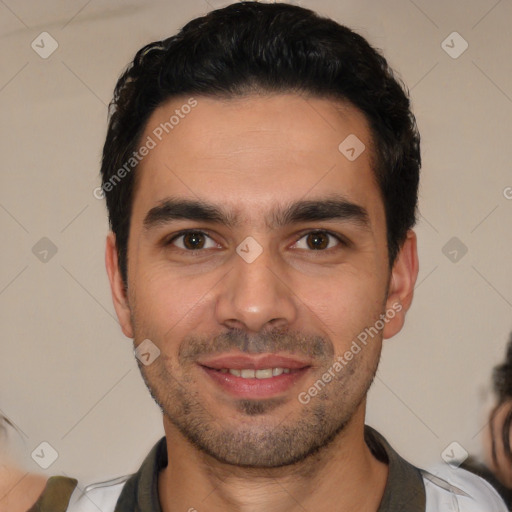 Joyful white young-adult male with short  black hair and brown eyes