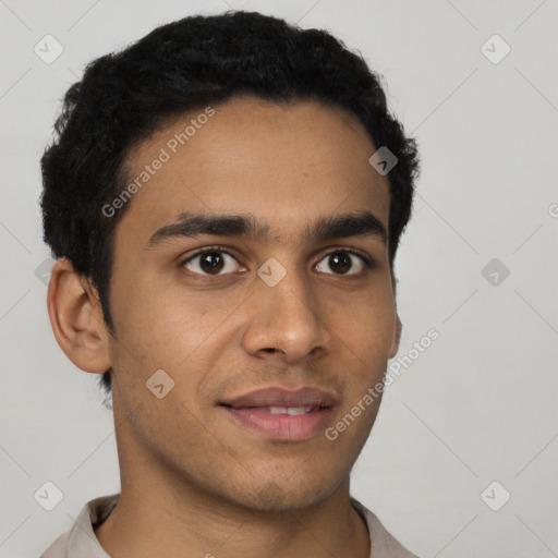 Joyful latino young-adult male with short  brown hair and brown eyes