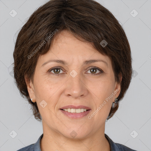 Joyful white adult female with medium  brown hair and brown eyes