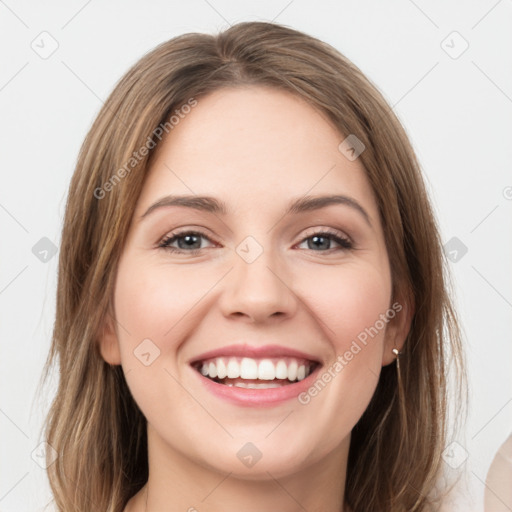 Joyful white young-adult female with medium  brown hair and grey eyes