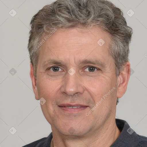 Joyful white middle-aged male with short  brown hair and brown eyes