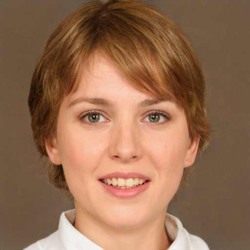 Joyful white young-adult female with medium  brown hair and green eyes