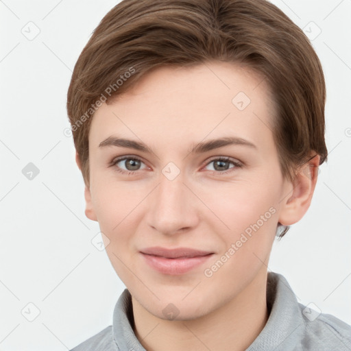 Joyful white young-adult female with short  brown hair and grey eyes