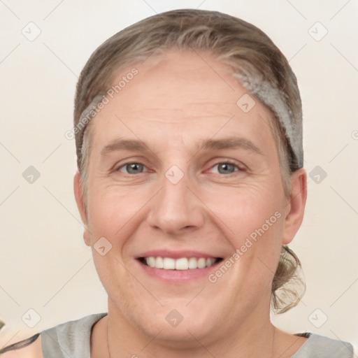 Joyful white adult female with short  brown hair and grey eyes