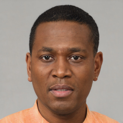 Neutral black adult male with short  black hair and brown eyes