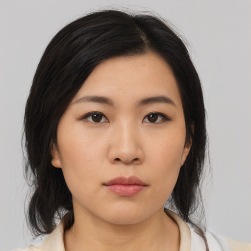 Neutral asian young-adult female with medium  black hair and brown eyes