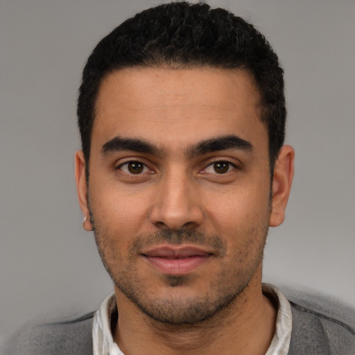 Neutral latino young-adult male with short  black hair and brown eyes