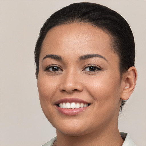 Joyful white young-adult female with short  brown hair and brown eyes