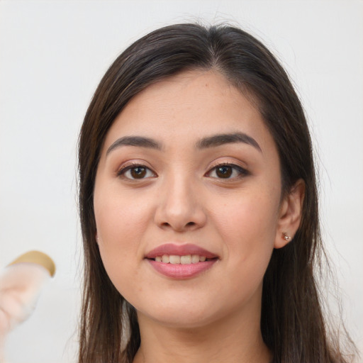 Joyful white young-adult female with long  brown hair and brown eyes