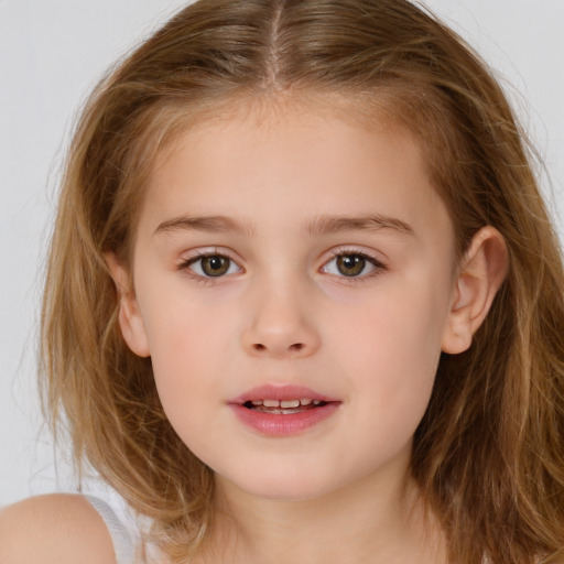 Joyful white child female with long  brown hair and brown eyes