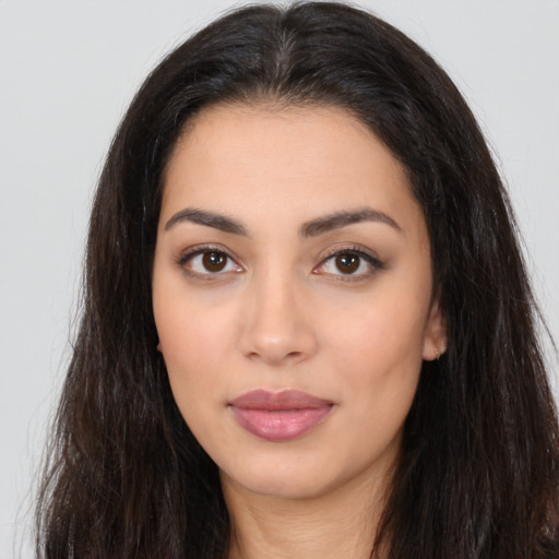 Neutral latino young-adult female with long  brown hair and brown eyes