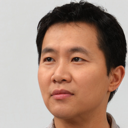 Neutral asian young-adult male with short  black hair and brown eyes