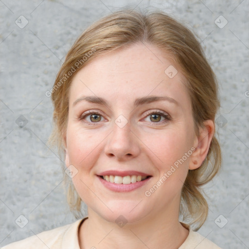 Joyful white young-adult female with medium  brown hair and blue eyes