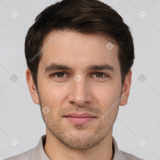 Joyful white young-adult male with short  brown hair and brown eyes