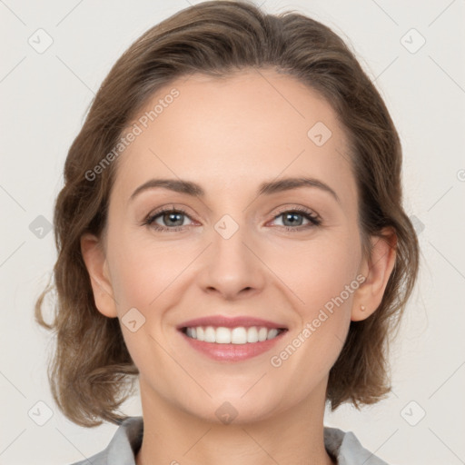 Joyful white young-adult female with medium  brown hair and grey eyes