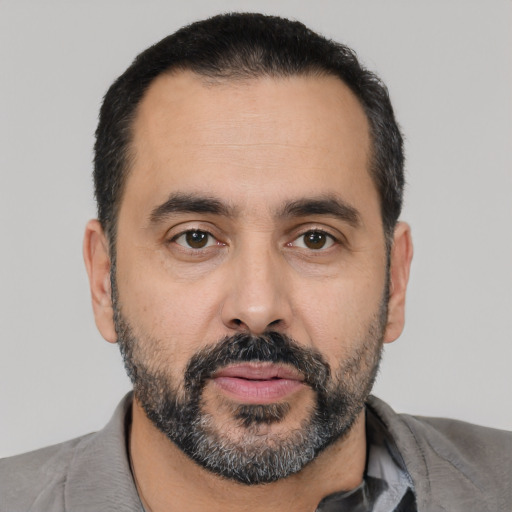 Neutral latino adult male with short  black hair and brown eyes