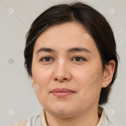 Joyful white adult female with medium  brown hair and brown eyes