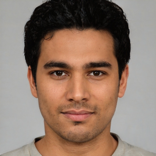 Neutral latino young-adult male with short  black hair and brown eyes