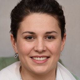 Joyful white adult female with short  brown hair and brown eyes