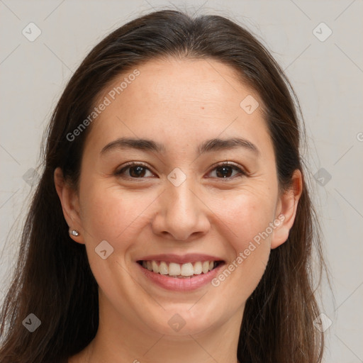 Joyful white young-adult female with long  brown hair and brown eyes