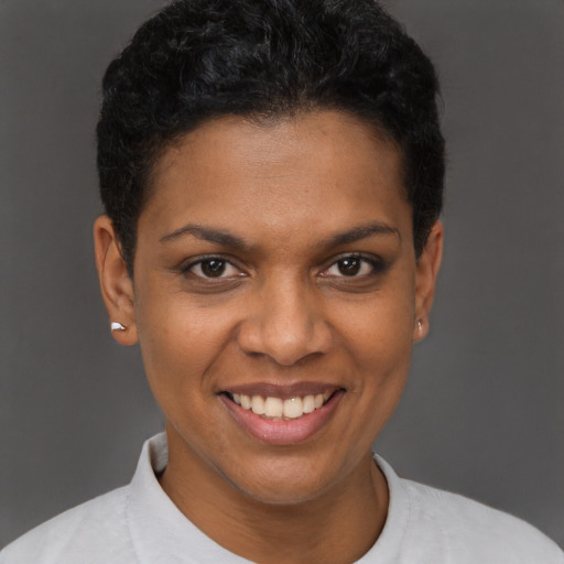Joyful black young-adult female with short  brown hair and brown eyes