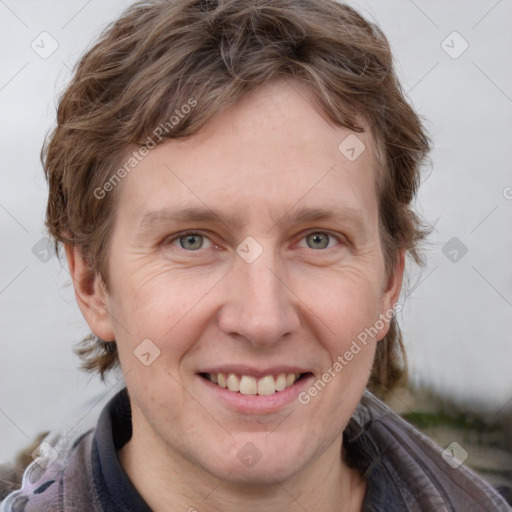 Joyful white adult female with short  brown hair and grey eyes